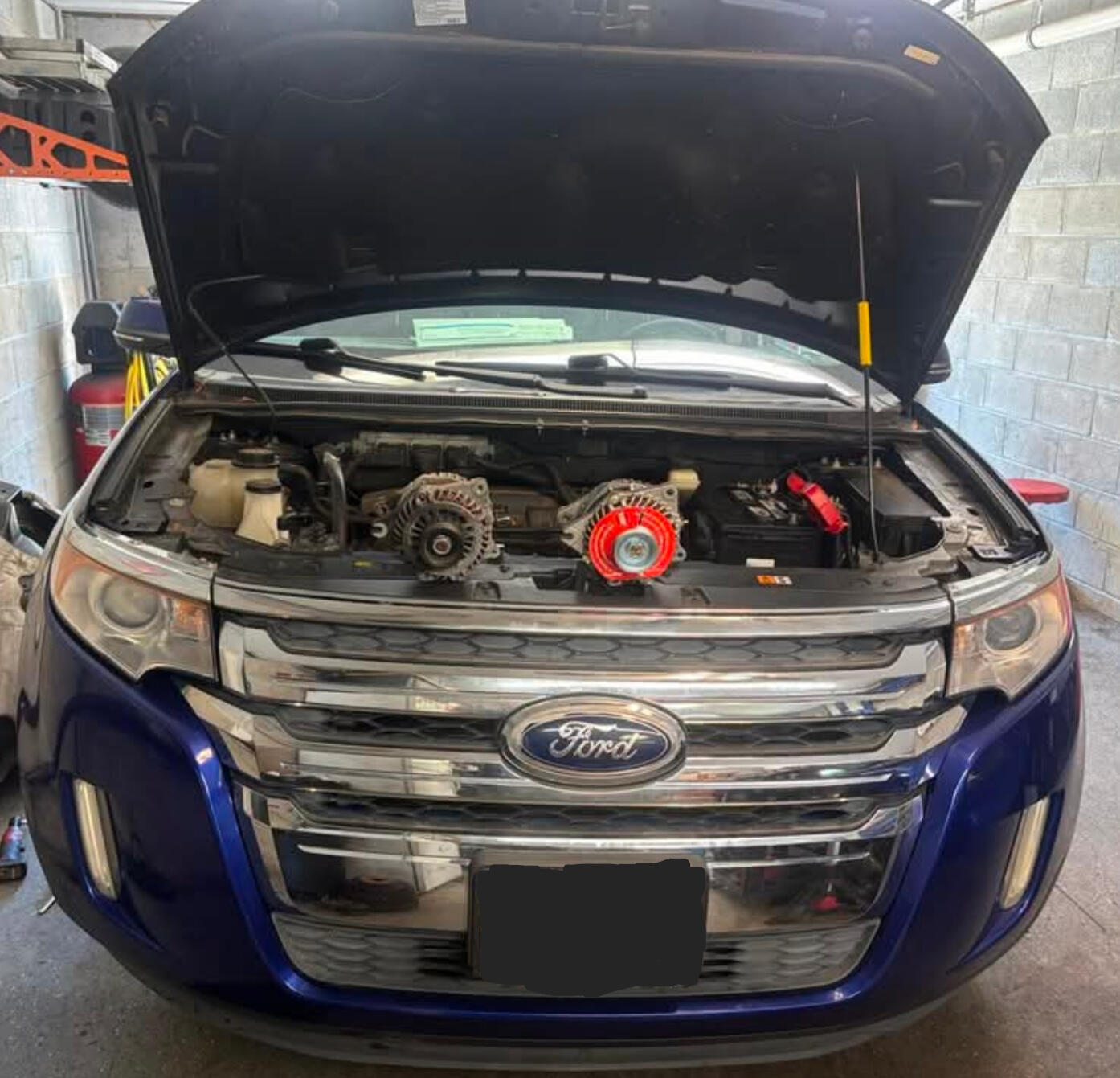 Mobile Alternator Replacement Service in Fort Worth TX Mobile mechanic replacing an alternator on a Ford Edge in Fort Worth Texas