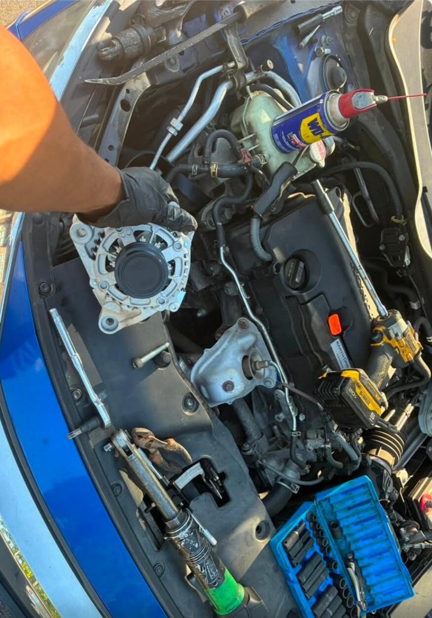 Ready To Get Your Alternator Replaced? Mobile mechanic installing a replacement alternator during on-site auto repair service in Fort Worth TX